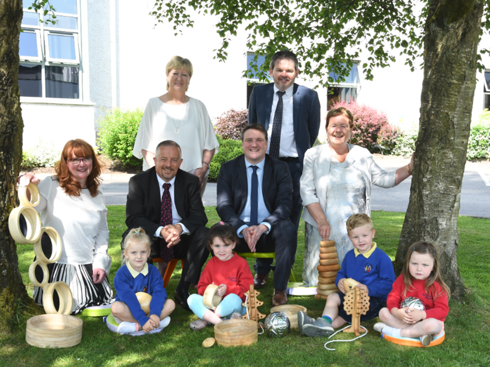 (Back L-R) Denise McCormilla NCN, Lauri McCusker Fermanagh Trust. (Front L-R) Alison Chambers Department of Education, Ian McKenna Department of Education and Skills, Mark Feeney SEUPB and Siobhan Fitzpatrick Early Years. With children from Ardstraw Playgroup and Little Flower Playgroup