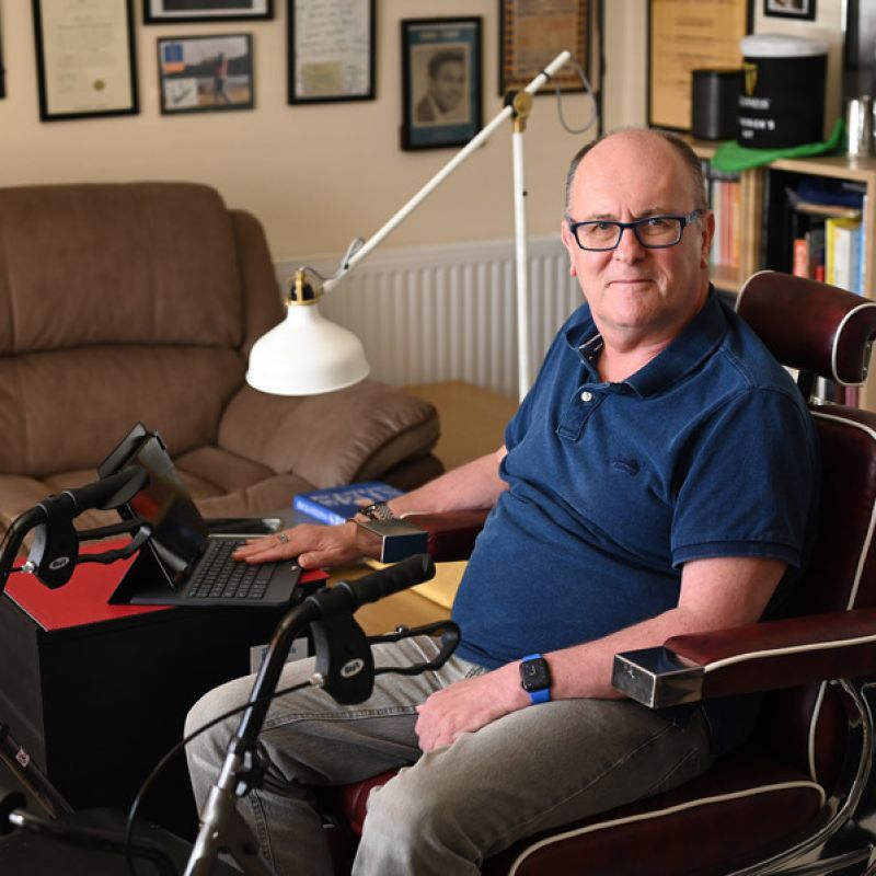 Citizen pictured in a wheelchair with laptop