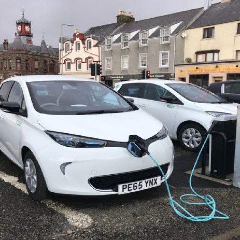 an electric car at an electric charging point